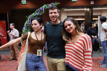 Yelena and Matt Caputo embracing Caterina Gallo at Northwest Chocolate Festival 2025.